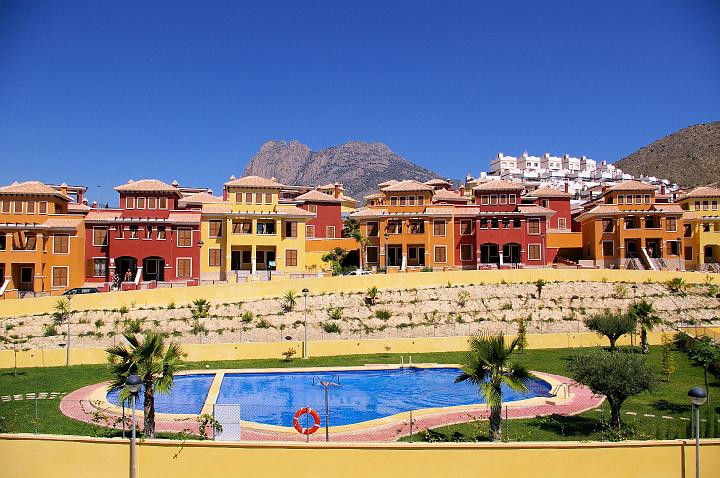 IMGP0096.JPG - The communal swimming pool with Puig Campana mountain in the background. Photo taken from the property.